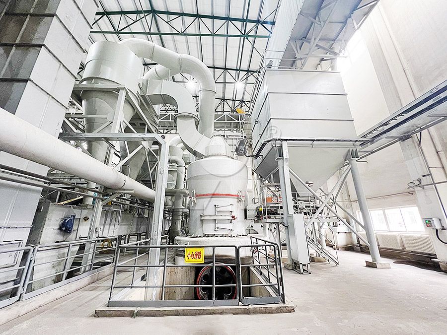 Interior view of a medium-speed grinding mill showing grinding rollers and ring